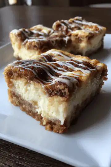 Ooey-Gooey Cinnamon Roll Cheesecake Bars