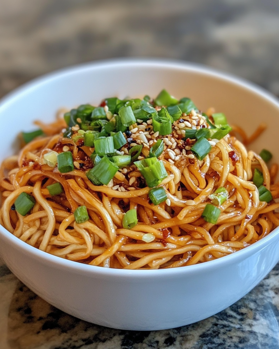 Ingredients for Dan Dan noodles including peanuts, chili flakes, and sesame paste