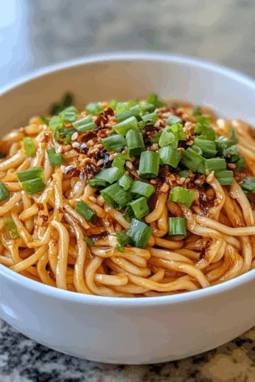 Crispy Scallion Dan Dan Noodles recipe taken with iphone 15 pro max --iw 2 --ar 4:5 --v 6.1 --raw