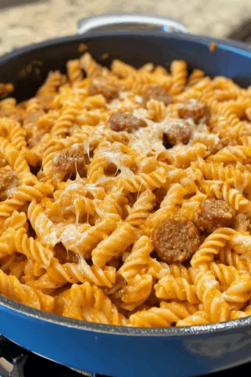 One Pot Cheesy Sausage Pasta taken with iphone 15 pro max --iw 2 --ar 4:5 --v 6.1 --raw