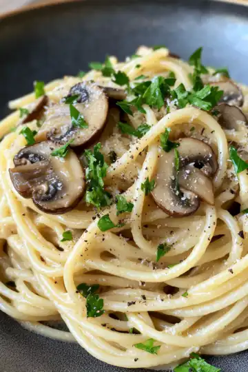 15 Minute Mushroom Spaghetti Aglio Olio Recipe taken with iphone 15 pro max --iw 2 --ar 4:5 --v 6.1 --raw