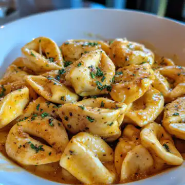 Cajun Chicken Tortellini With Garlic Sauce taken with iphone 15 pro max --iw 2 --ar 4:5 --v 6.1 --raw