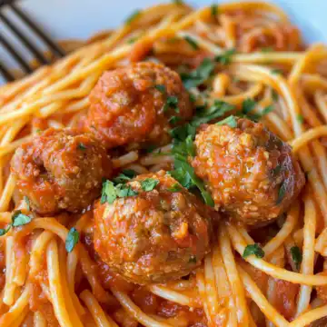 Creamy Spaghetti And Meatballs Recipe Quick Easy taken with iphone 15 pro max --iw 2 --ar 4:5 --v 6.1 --raw