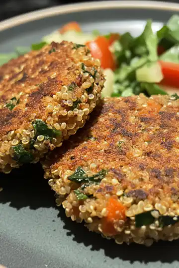 Crunchy Quinoa Veggie Patties taken with iphone 15 pro max --iw 2 --ar 4:5 --v 6.1 --raw