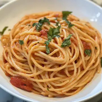 Easy And Creamy Tomato Garlic Pasta Recipe taken with iphone 15 pro max --iw 2 --ar 4:5 --v 6.1 --raw