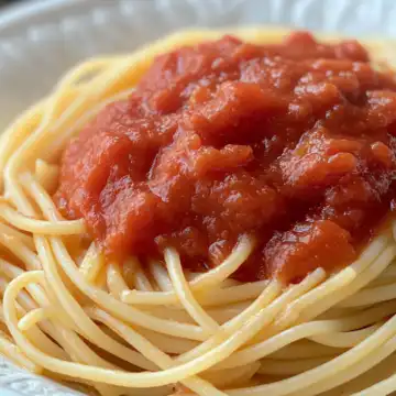 How To Make Homemade Italian Spaghetti Sauce taken with iphone 15 pro max --iw 2 --ar 4:5 --v 6.1 --raw