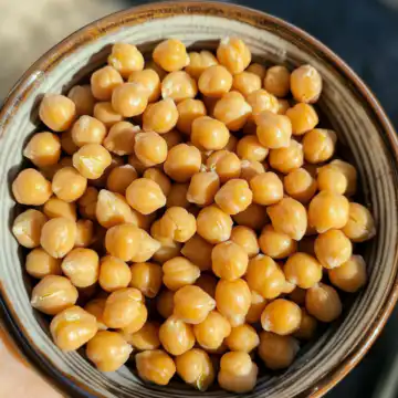 Marry Me Chickpeas taken with iphone 15 pro max --iw 2 --ar 4:5 --v 6.1 --raw