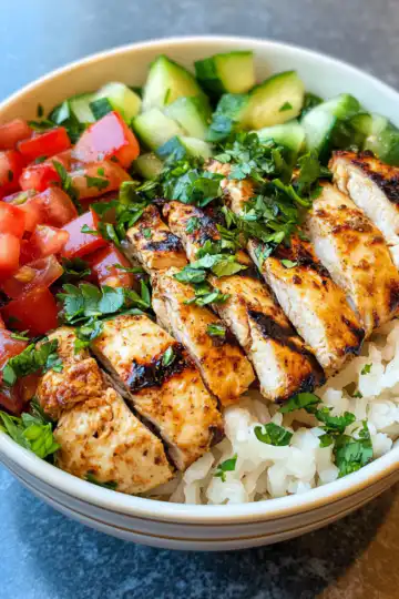 Mediterranean Chicken Bowl taken with iphone 15 pro max --iw 2 --ar 4:5 --v 6.1 --raw