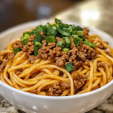 Mongolian Ground Beef Noodles taken with iphone 15 pro max --iw 2 --ar 4:5 --v 6.1 --raw