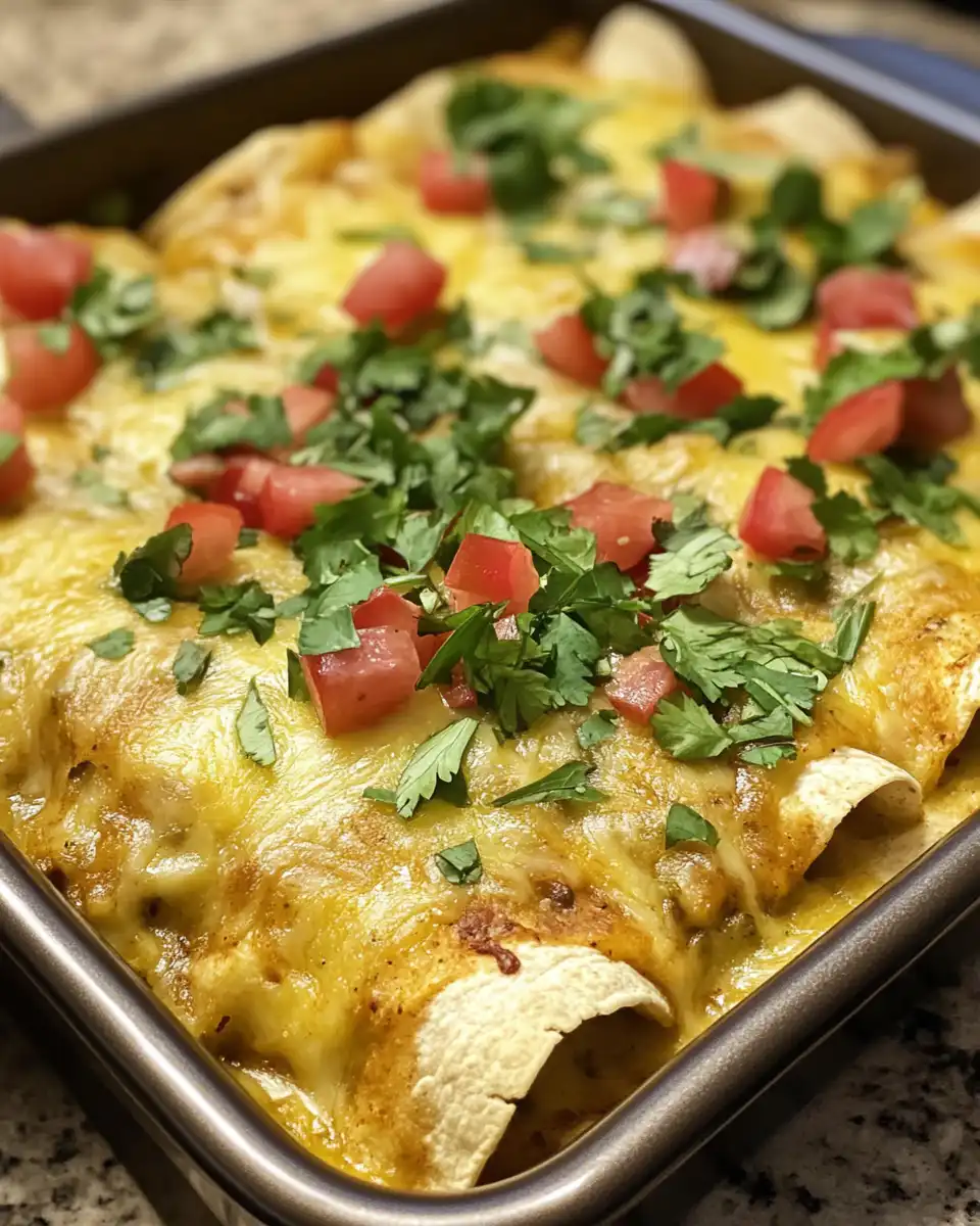 Served plant-based potato and green chili enchiladas on a plate ready to enjoy