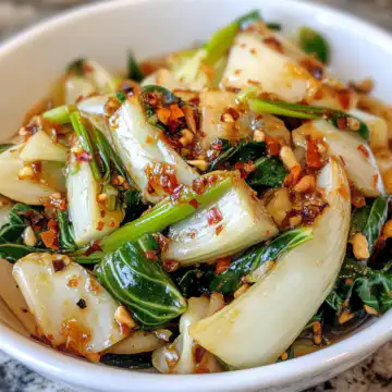 Quick Bok Choy With Ginger Chili Sauce taken with iphone 15 pro max --iw 2 --ar 4:5 --v 6.1 --raw