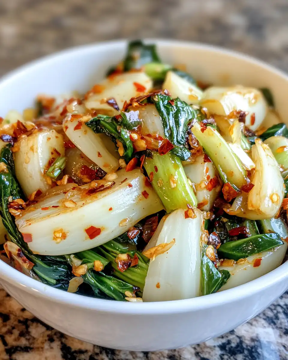 Finished plated quick bok choy with ginger chili sauce ready to enjoy