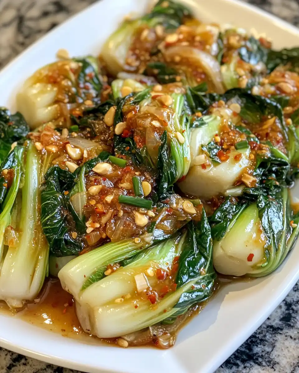 Freshly cooked quick bok choy steaming in pressure cooker with ginger chili sauce