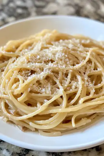 Simple Caramelized Onion Pasta Recipe taken with iphone 15 pro max --iw 2 --ar 4:5 --v 6.1 --raw