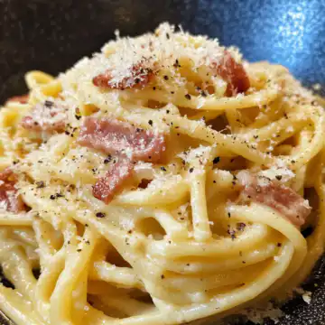 Spaghetti Carbonara taken with iphone 15 pro max --iw 2 --ar 4:5 --v 6.1 --raw