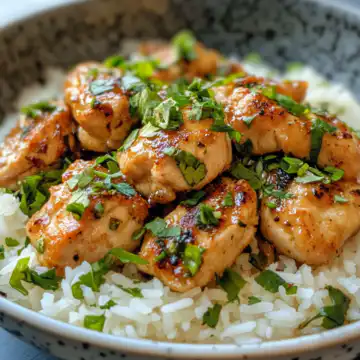 Spicy Maple Chicken And Coconut Rice taken with iphone 15 pro max --iw 2 --ar 4:5 --v 6.1 --raw