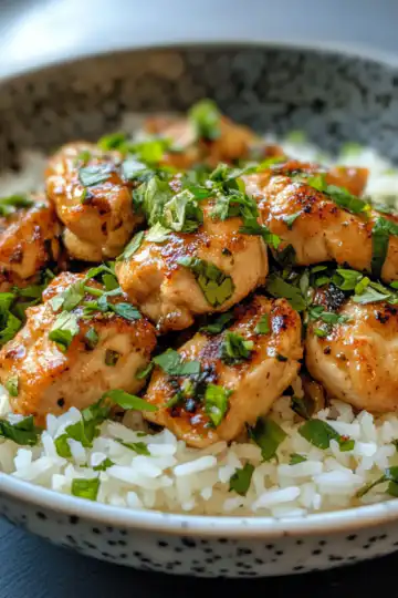 Spicy Maple Chicken And Coconut Rice taken with iphone 15 pro max --iw 2 --ar 4:5 --v 6.1 --raw