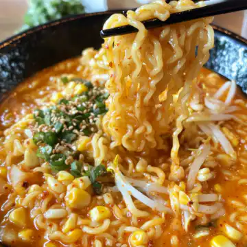 Spicy Noodles With Korean Corn Cheese taken with iphone 15 pro max --iw 2 --ar 4:5 --v 6.1 --raw