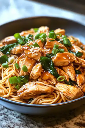 Sticky Garlic Chicken Noodles Recipe taken with iphone 15 pro max --iw 2 --ar 4:5 --v 6.1 --raw