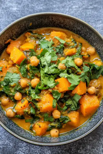 Sweet Potato And Chickpea Curry taken with iphone 15 pro max --iw 2 --ar 4:5 --v 6.1 --raw