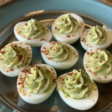 Avocado deviled eggs taken with iphone 15 pro max --iw 2 --ar 4:5 --v 6.0 --raw