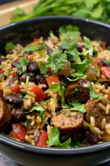 Black Beans and Rice with Sausage taken with iphone 15 pro max --iw 2 --ar 4:5 --v 6.0 --raw