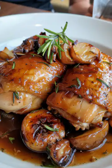 Braised Catalina Chicken taken with iphone 15 pro max --iw 2 --ar 4:5 --v 6.0 --raw