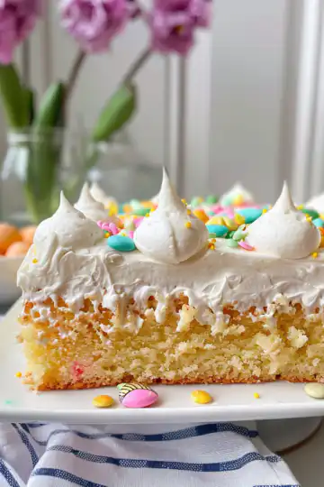 Bright and Easy Easter Poke Cake taken with iphone 15 pro max --iw 2 --ar 4:5 --v 6.0 --raw
