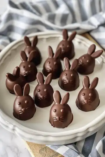 Bunny-Shaped Chocolate Truffles taken with iphone 15 pro max --iw 2 --ar 4:5 --v 6.0 --raw