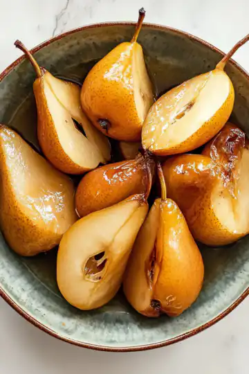 Buttery Roasted Pears Recipe taken with iphone 15 pro max --iw 2 --ar 4:5 --v 6.1 --raw