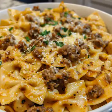 Cajun Cream Cheese Alfredo Bowties with Spiced Ground Beef taken with iphone 15 pro max --iw 2 --ar 4:5 --v 6.0 --raw