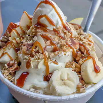 Caramel Apple Pie Yogurt Bowl taken with iphone 15 pro max --iw 2 --ar 4:5 --v 6.0 --raw