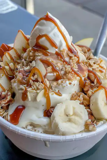 Caramel Apple Pie Yogurt Bowl taken with iphone 15 pro max --iw 2 --ar 4:5 --v 6.0 --raw