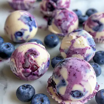 Easy Blueberry Swirl Yogurt Bites Recipe taken with iphone 15 pro max --iw 2 --ar 4:5 --v 6.0 --raw