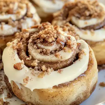 Fluffy Banana Bread Cinnamon Rolls with Cream Cheese Frosting taken with iphone 15 pro max --iw 2 --ar 4:5 --v 6.1 --raw
