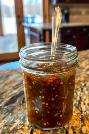 Homemade Dragon Sauce taken with iphone 15 pro max --iw 2 --ar 4:5 --v 6.0 --raw