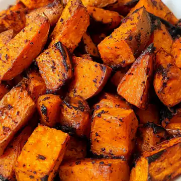 Honey Roasted Sweet Potatoes taken with iphone 15 pro max --iw 2 --ar 4:5 --v 6.1 --raw