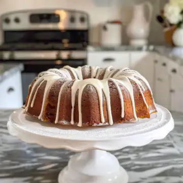 Moist Carrot Bundt Cake taken with iphone 15 pro max --iw 2 --ar 4:5 --v 6.0 --raw