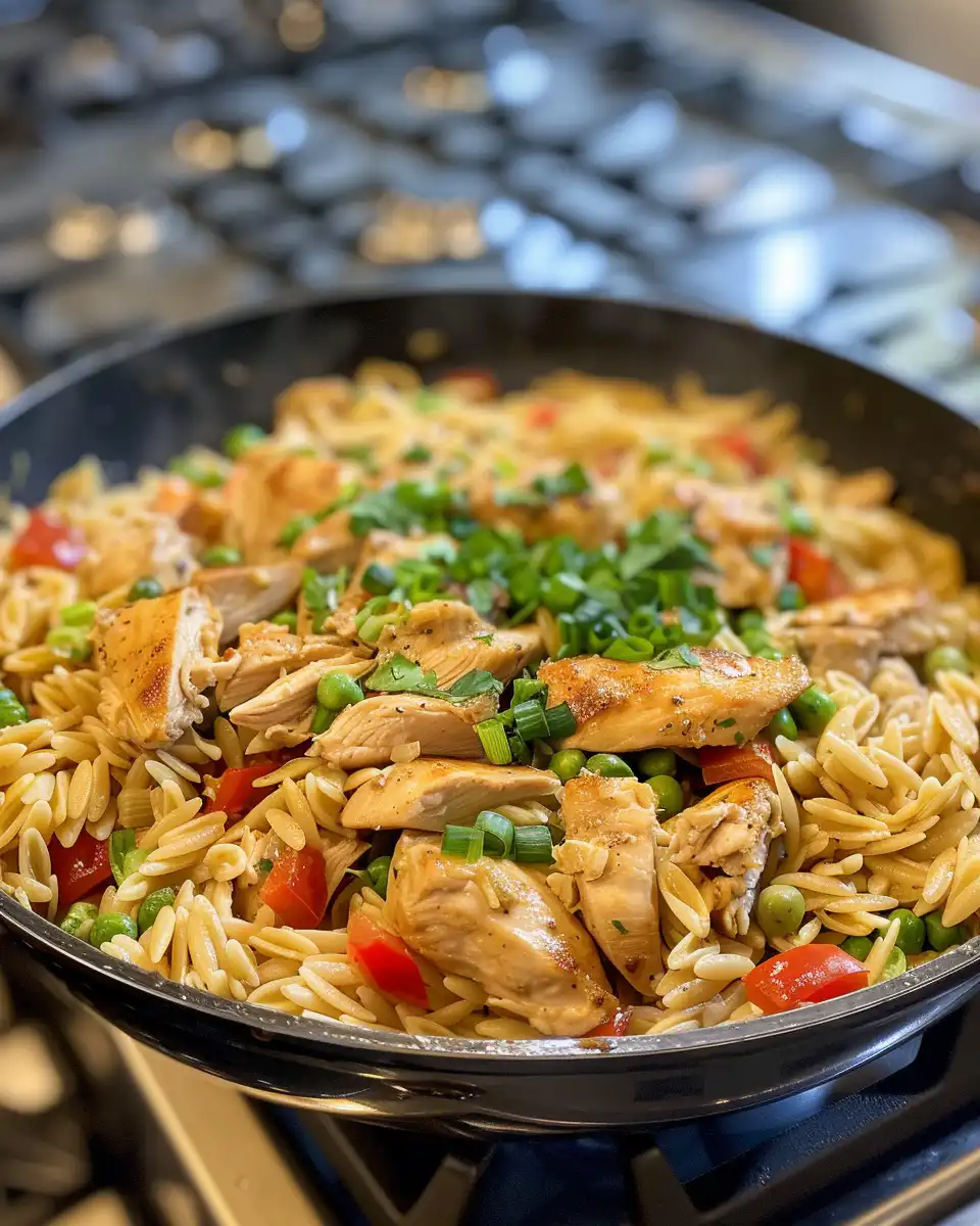 Creamy Cajun chicken alfredo orzo with tofu and broccoli served hot