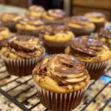 Nutella Banana Swirl Muffins taken with iphone 15 pro max --iw 2 --ar 4:5 --v 6.0 --raw