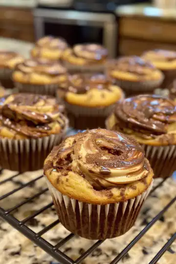 Nutella Banana Swirl Muffins taken with iphone 15 pro max --iw 2 --ar 4:5 --v 6.0 --raw