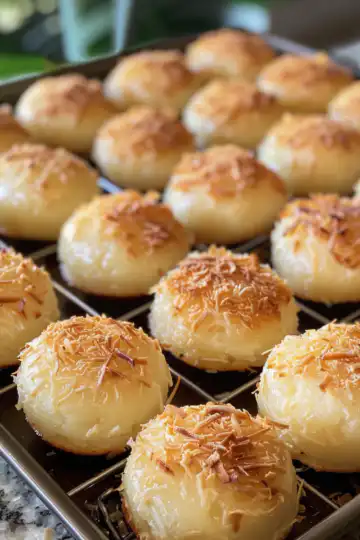 Portuguese Coconut Cakes taken with iphone 15 pro max --iw 2 --ar 4:5 --v 6.0 --raw