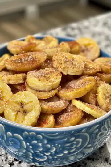 Quick & Easy Cinnamon-Sugar Air Fryer Banana Chips taken with iphone 15 pro max --iw 2 --ar 4:5 --v 6.0 --raw