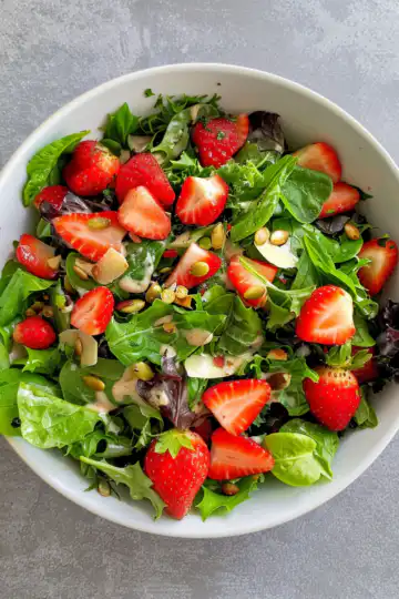 Refreshing Strawberry Crackle Salad taken with iphone 15 pro max --iw 2 --ar 4:5 --v 6.0 --raw