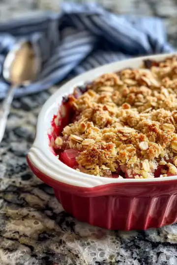 Rhubarb Crisp taken with iphone 15 pro max --iw 2 --ar 4:5 --v 6.0 --raw