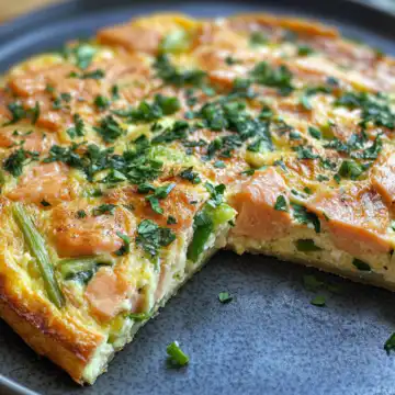 Salmon Leek Frittata taken with iphone 15 pro max --iw 2 --ar 4:5 --v 6.1 --raw