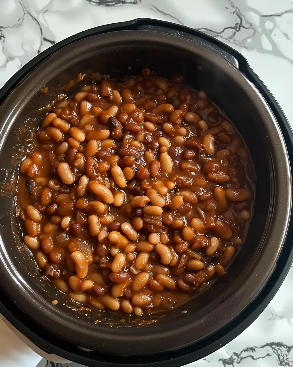 Stirring ingredients in slow cooker for baked beans