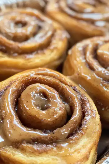 Soft & Fluffy Biscoff Cookie Butter Cinnamon Rolls taken with iphone 15 pro max --iw 2 --ar 4:5 --v 6.1 --raw