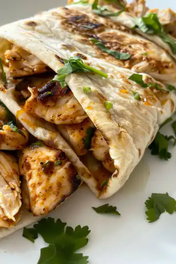 Sweet Chili Chicken Wraps taken with iphone 15 pro max --iw 2 --ar 4:5 --v 6.0 --raw
