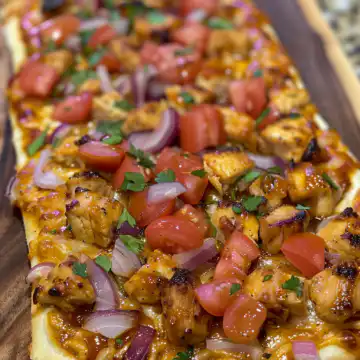 BBQ Chicken Flatbread taken with iphone 15 pro max --iw 2 --ar 4:5 --v 6.0 --raw